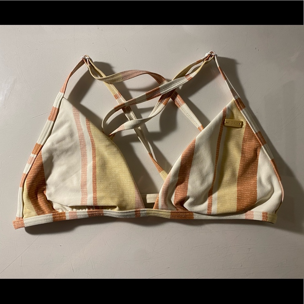 Roxy top, size extra small, with the colors yellow, pink, orange, and white.